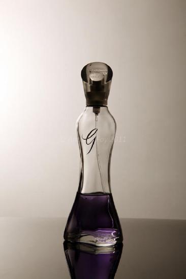 A perfume bottle with a spray cap.