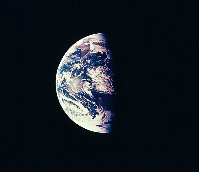 A view of Earth shows part of it is in daylight, part in nighttime.