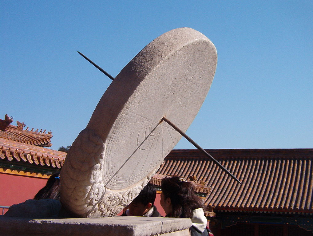 A large sundial made of stone and steel is shown in Beijing.