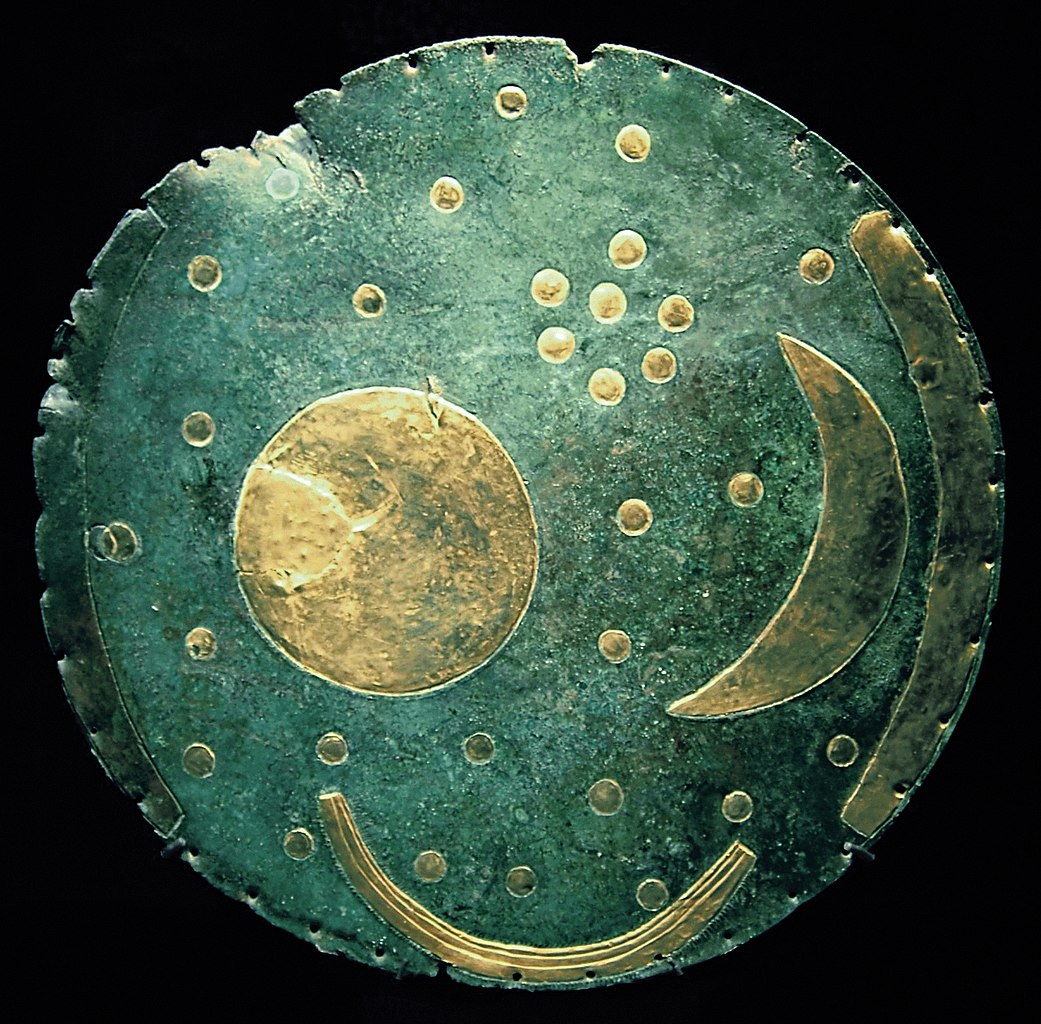 A bronze disk, ca. 1600 BC, from Nebra, Germany is shown with the sun, moon, and stars.