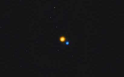 The orange and blue stars of Albireo are shown.