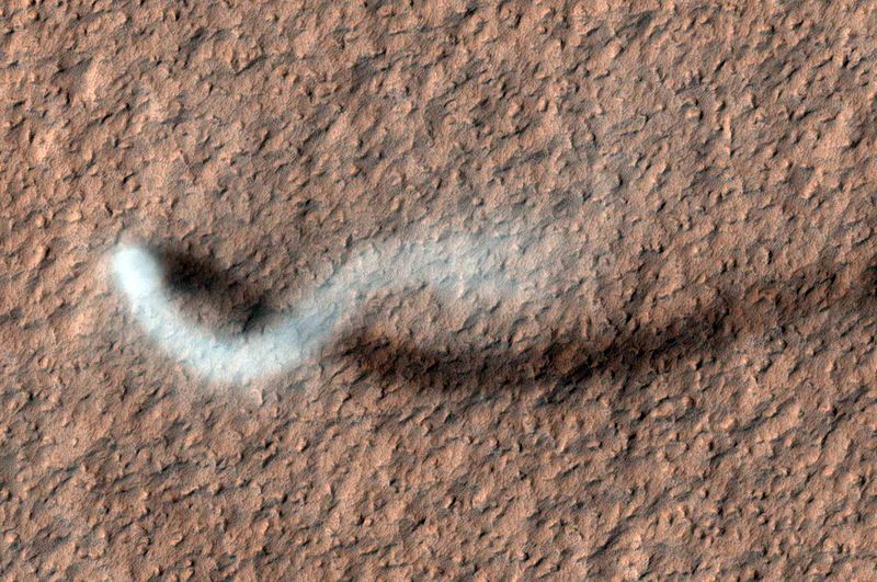 A Martian Dust Devil and its shadow are shown.