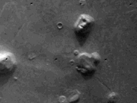 Viking orbiter photo the "Face of Mars." While it may to be a face, it is actually an artifact of poor resolution and shadows. https://commons.wikimedia.org/wiki/File:Viking_1_F035A72-cropped-enhanced.png