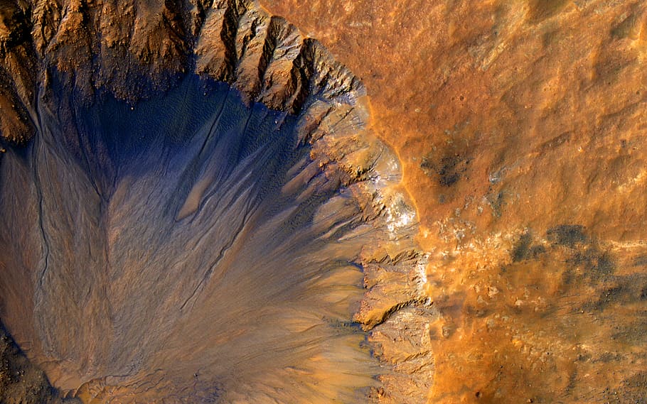 A crater on Mars showing erosion features. https:/www.pxfuel.com/en/search?q=mars; 