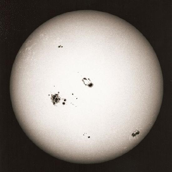 Sunspots appear as dark blemishes on the surface of the Sun. https://commons.wikimedia.org/wiki/File:Sunspots_11000_years.svg