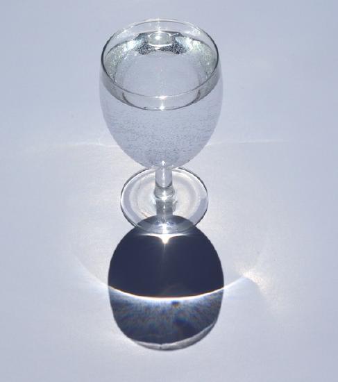 Parallel rays focused to a single point by a lens.