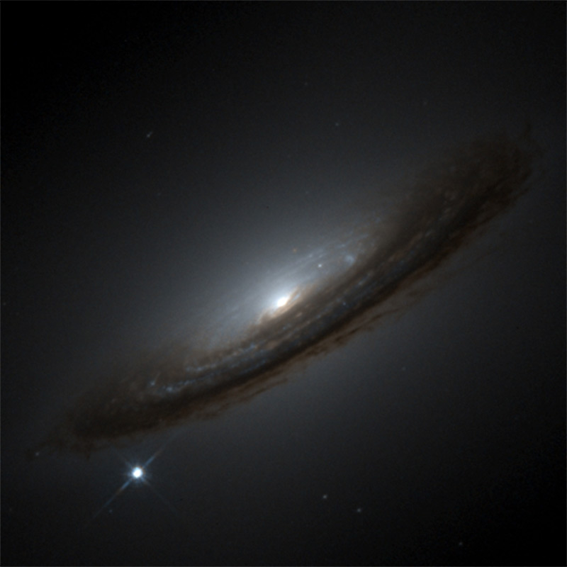 Image of Very bright star, Supernova SN1994D, shown in comparison to its less bright Spiral Galaxy NGC4526.