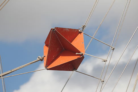 A photograph of a radar reflector on the rigging of a sailboat.