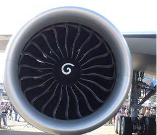 Picture is a photo of an air turbine under the wing of an airplane.