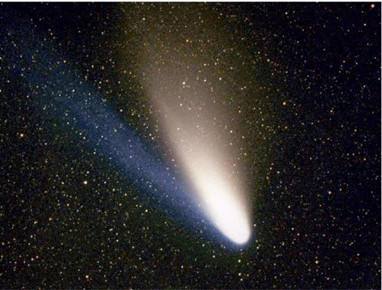 The photograph of a moving Hale Bopp comet in space is shown as bright lighted object.