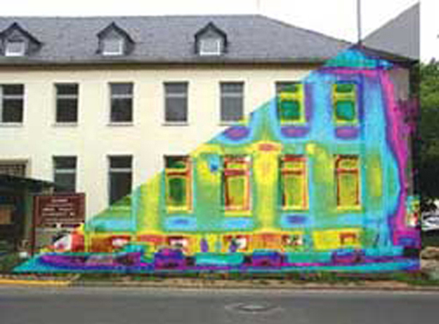 Figure shows a photograph of a building overlaid by its thermograph. The thermograph shows different areas of the building in different colours. The windows are yellow with red frames.