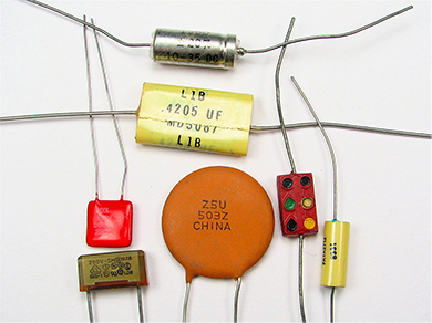 A photograph of different types of capacitors.