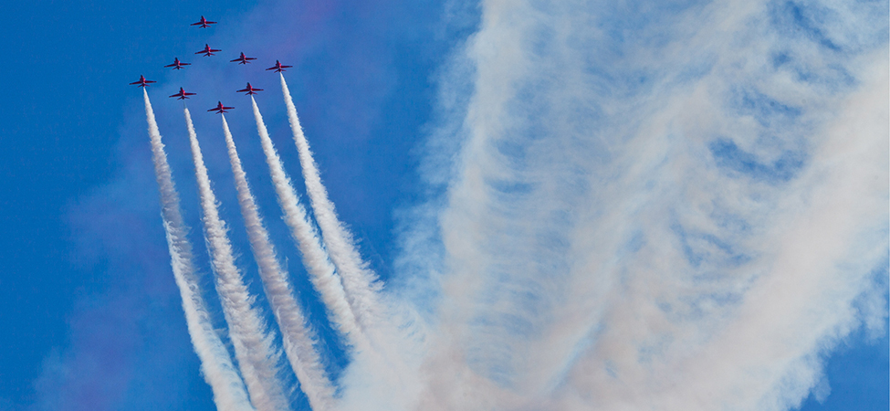 A photograph of nine jets flying in formation.