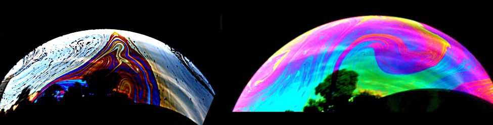 Uma fotografia de duas bolhas é mostrada. As bolhas têm cores vivas que vão do rosa ao azul escuro e variam em toda a superfície.